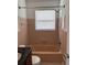 Well-lit bathroom features a tub and shower combination at 6081 22Nd N Ave, St Petersburg, FL 33710