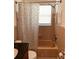 Cozy bathroom with granite counters and peach tile in the shower at 6081 22Nd N Ave, St Petersburg, FL 33710