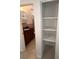 Bathroom featuring sink and vanity next to a closet with open shelving at 6081 22Nd N Ave, St Petersburg, FL 33710