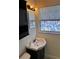 Bathroom with vanity, toilet and an artistic window accent at 6081 22Nd N Ave, St Petersburg, FL 33710