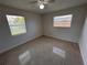 This bedroom has terrazzo flooring and natural light from dual windows at 6081 22Nd N Ave, St Petersburg, FL 33710