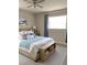 Relaxing bedroom featuring a comfortable bed, accent pillows, and soft blue curtains at 6081 22Nd N Ave, St Petersburg, FL 33710