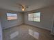 This bedroom has terrazzo flooring and natural light from dual windows at 6081 22Nd N Ave, St Petersburg, FL 33710
