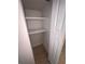Small open closet with white shelves and bi-fold doors, providing efficient storage at 6081 22Nd N Ave, St Petersburg, FL 33710