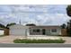 Charming single-story home with attached garage and well-maintained landscaping at 6081 22Nd N Ave, St Petersburg, FL 33710