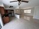 Bright open-concept living and kitchen area with terrazzo floors and stainless steel appliances at 6081 22Nd N Ave, St Petersburg, FL 33710