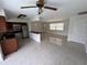 Bright open-concept living and kitchen area with terrazzo floors and stainless steel appliances at 6081 22Nd N Ave, St Petersburg, FL 33710