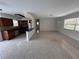 Bright open-concept living area features terrazzo floors and an updated kitchen with stainless steel appliances at 6081 22Nd N Ave, St Petersburg, FL 33710