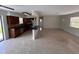 Bright living room open to the kitchen featuring terrazzo floors and neutral paint at 6081 22Nd N Ave, St Petersburg, FL 33710