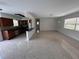 Bright living room open to the kitchen featuring terrazzo floors and neutral paint at 6081 22Nd N Ave, St Petersburg, FL 33710