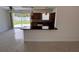 Living room area open to the kitchen and a view of the outdoor patio at 6081 22Nd N Ave, St Petersburg, FL 33710