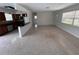 Bright open-concept living area features terrazzo floors and an updated kitchen with stainless steel appliances at 6081 22Nd N Ave, St Petersburg, FL 33710