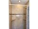 Bathroom shower featuring decorative tiled walls and mosaic border with integrated shelving at 6081 22Nd N Ave, St Petersburg, FL 33710