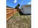 Side yard with a wooden fence, offering additional space and privacy on the property at 6081 22Nd N Ave, St Petersburg, FL 33710