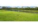 Spacious, well-maintained backyard with black fence and scenic lake view, perfect for outdoor activities at 6226 165Th E Dr, Parrish, FL 34219