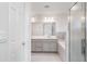 Ensuite bathroom with dual vanity, tub, and glass-enclosed shower at 6226 165Th E Dr, Parrish, FL 34219