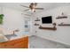 Bright bedroom with shelves, window, and ceiling fan at 6226 165Th E Dr, Parrish, FL 34219