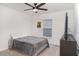 Simple bedroom with a bed, TV, and ceiling fan at 6226 165Th E Dr, Parrish, FL 34219