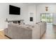 Spacious living room featuring modern furnishings, light wood floors, and plenty of natural light at 6226 165Th E Dr, Parrish, FL 34219