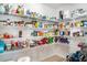 Walk-in pantry with ample shelving filled with food and household supplies at 6226 165Th E Dr, Parrish, FL 34219