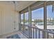 View from the screened-in balcony showcasing views of the harbor, landscaping, and parking at 7400 Sun Island S Dr # 412, South Pasadena, FL 33707