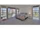 Bedroom has beautiful views and a floral print comforter at 7400 Sun Island S Dr # 412, South Pasadena, FL 33707