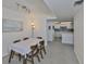 Dining room view shows the nearby kitchen at 7400 Sun Island S Dr # 412, South Pasadena, FL 33707