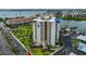 Exterior shot of the condo building, showcasing well-maintained lawns and landscaping around the property at 7400 Sun Island S Dr # 412, South Pasadena, FL 33707