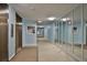 Hallway with mirrored wall, elevator and neutral carpeting provides easy access to units at 7400 Sun Island S Dr # 412, South Pasadena, FL 33707