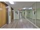 Hallway with elevator and mirrored wall creates a bright and appealing access to units at 7400 Sun Island S Dr # 412, South Pasadena, FL 33707