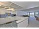 Bright kitchen opens to the living room with views of the water at 7400 Sun Island S Dr # 412, South Pasadena, FL 33707