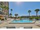 Resort style pool with lounge chairs, hot tub, and a beautiful waterfront backdrop at 7400 Sun Island S Dr # 412, South Pasadena, FL 33707