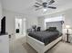 Bedroom with a white bed frame, ceiling fan, a desk and a television at 7708 Fairlawn Dr, Hudson, FL 34667