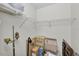 Walk-in closet with shelving for optimal storage at 7708 Fairlawn Dr, Hudson, FL 34667