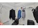 Walk-in closet with metal shelving, clothing racks, and personal items at 7708 Fairlawn Dr, Hudson, FL 34667