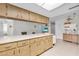 Kitchen features generous cabinet space, countertops, and an open layout at 7708 Fairlawn Dr, Hudson, FL 34667