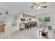 Open-concept kitchen featuring an island with seating, tile floors, and modern appliances at 7708 Fairlawn Dr, Hudson, FL 34667