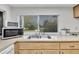 Kitchen sink with a view to the backyard at 7708 Fairlawn Dr, Hudson, FL 34667
