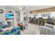 Open-concept living space with a kitchen, dining area, and comfortable seating at 7708 Fairlawn Dr, Hudson, FL 34667