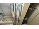 Bathtub featuring shower and water heater at 8718 N Brooks St, Tampa, FL 33604