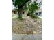 Ample driveway space and minimal landscaping provide a blank canvas for a homeowner's creative vision at 8718 N Brooks St, Tampa, FL 33604