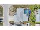 Aerial view of a single-Gathering home featuring a private screened-in pool and well-maintained landscaping at 9115 Panda Ln, Port Richey, FL 34668