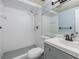 Bright bathroom featuring a stand-up shower with a new shower head and updated fixtures at 9115 Panda Ln, Port Richey, FL 34668