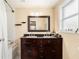 Bathroom vanity featuring dual sinks, granite counters, and tub with marble tiling at 9220 Mcintosh Rd, Dover, FL 33527