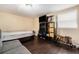 Bedroom with dark wood floors, a TV and shelving at 9220 Mcintosh Rd, Dover, FL 33527