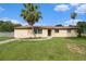 Charming home with a well-manicured front lawn and inviting curb appeal at 9220 Mcintosh Rd, Dover, FL 33527