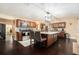 Well-appointed kitchen with granite counters, stainless steel appliances, and a central island with seating at 9220 Mcintosh Rd, Dover, FL 33527