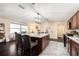 Kitchen featuring granite counters, stainless steel appliances, a center island, and hardwood floors at 9220 Mcintosh Rd, Dover, FL 33527