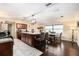 Open kitchen featuring granite counters, stainless steel appliances, and modern light fixtures at 9220 Mcintosh Rd, Dover, FL 33527