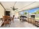 Enclosed patio featuring outdoor furniture and a ceiling fan at 9220 Mcintosh Rd, Dover, FL 33527